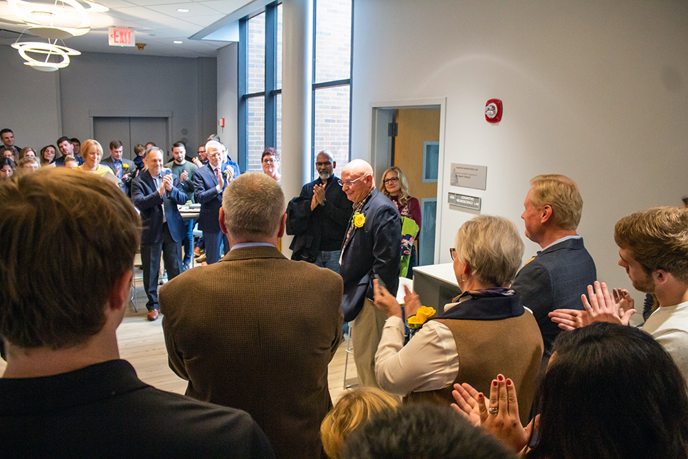 Image of Dr. Robert Tallitsch giving a speech outside Hanson 436, a room in Augustana College's Hanson Hall of Science that was dedicated to him after he left the college